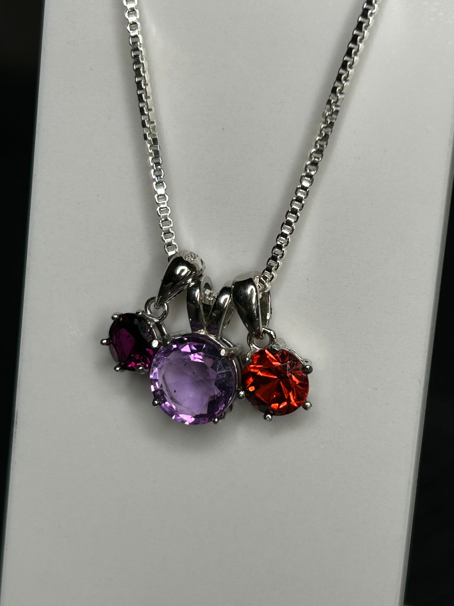 6mm Circle Garnet Pendant (on left)